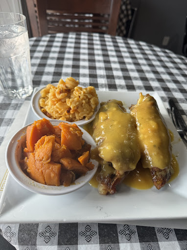Smothered turkey wings plate with candied yams and mac and cheese